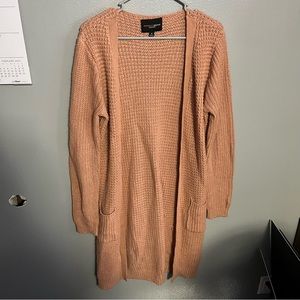Women’s cardigan, long peach color with pockets, size medium